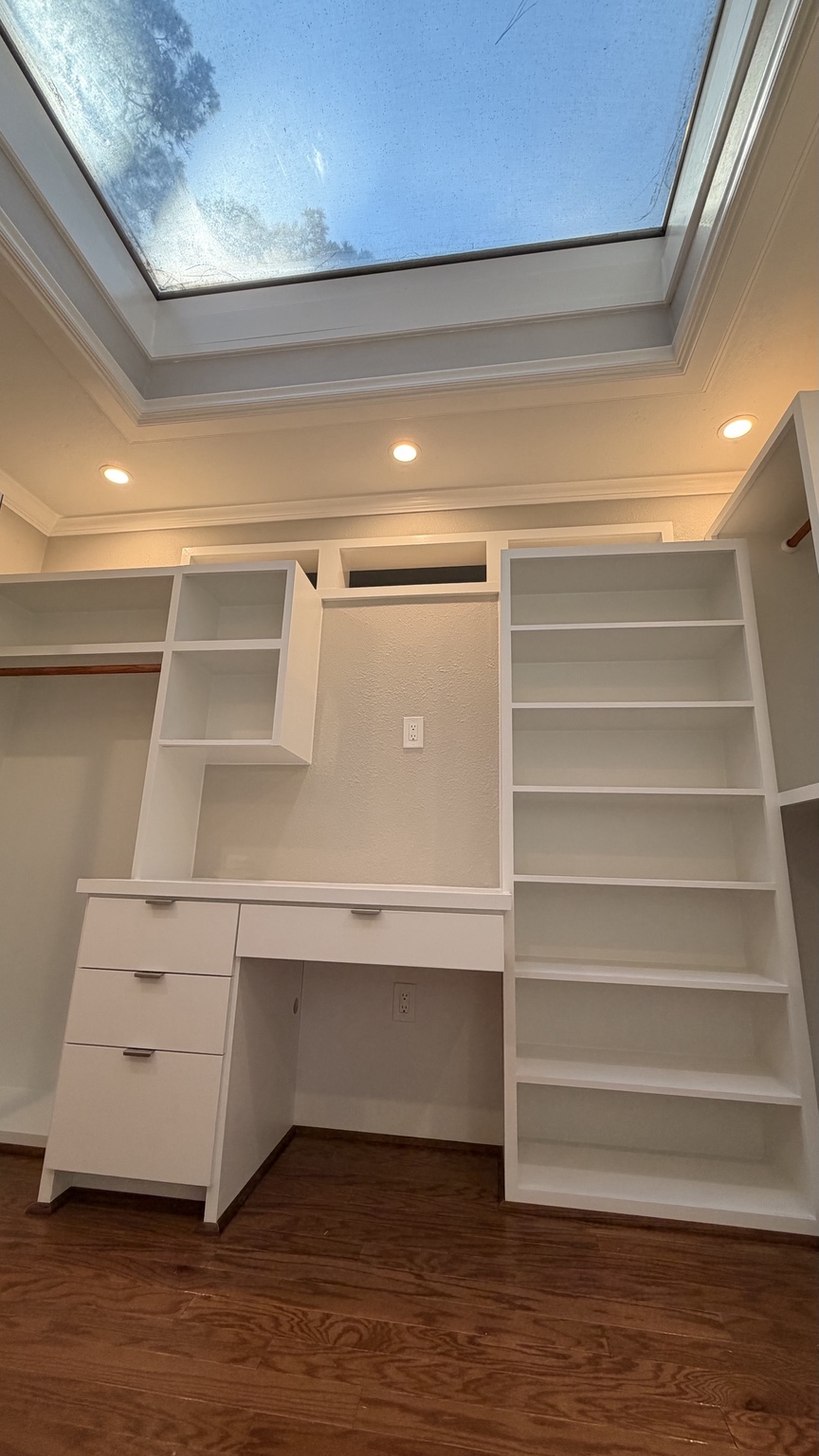 White dressing desk and custom closet shelving