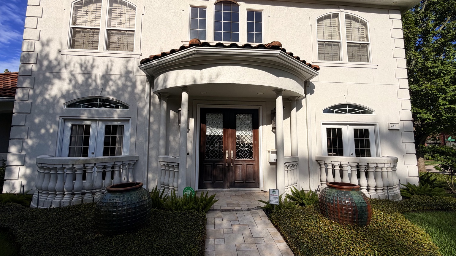 Houston residence before the entry and garage doors were refinished