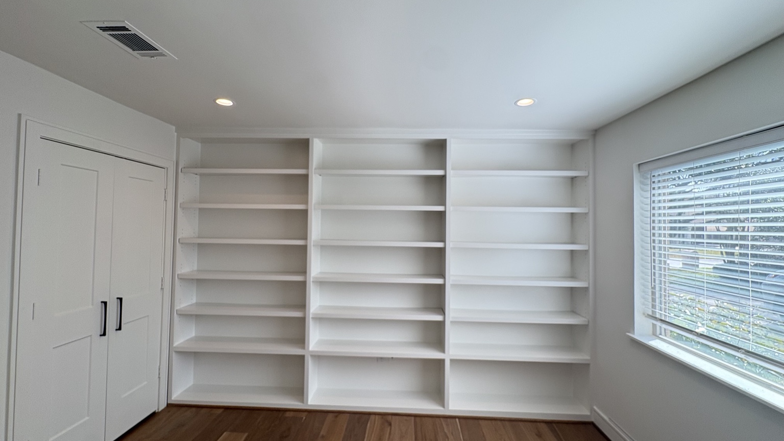Completed painted built-in shelving